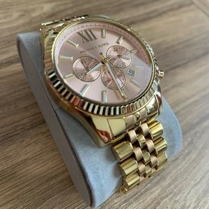 Michael Kors gold watch pink face.